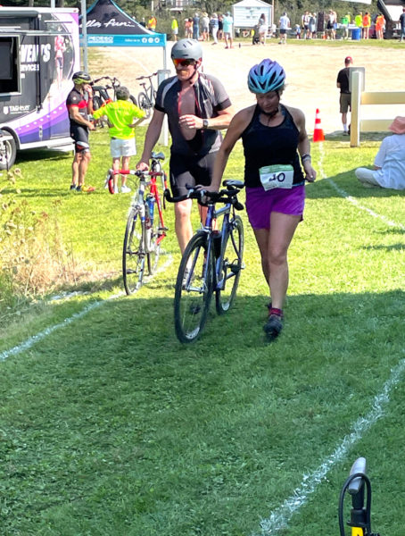 The author returns to the transition area after completing the bike segment of the Pemaquid Beach Triathlon. (Photo courtesy Sarah Plummer)