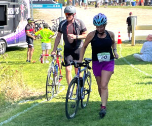 The author returns to the transition area after completing the bike segment of the Pemaquid Beach Triathlon. (Photo courtesy Sarah Plummer)