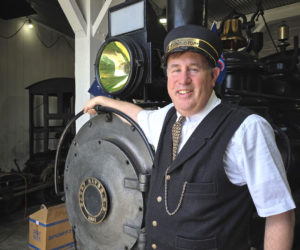 General Passenger Agent Ed Lecuyer, in his volunteer conductor uniform, rests his arm on Steam Locomotive No. 9 at the Wiscasset, Waterville and Farmington Railway Museum in Alna. No. 9 is one of two surviving locomotive from the original WW&F railroad and the only one still running. (Christine Simmonds photo)