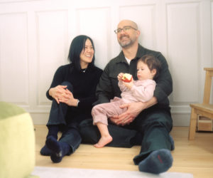 Author-illustrators Susan Fang and Peter Brown smile with their son Calvin. The two moved to Newcastle in 2022 and continue to write and draw from their home. (Photo courtesy Kelsey Grossman)