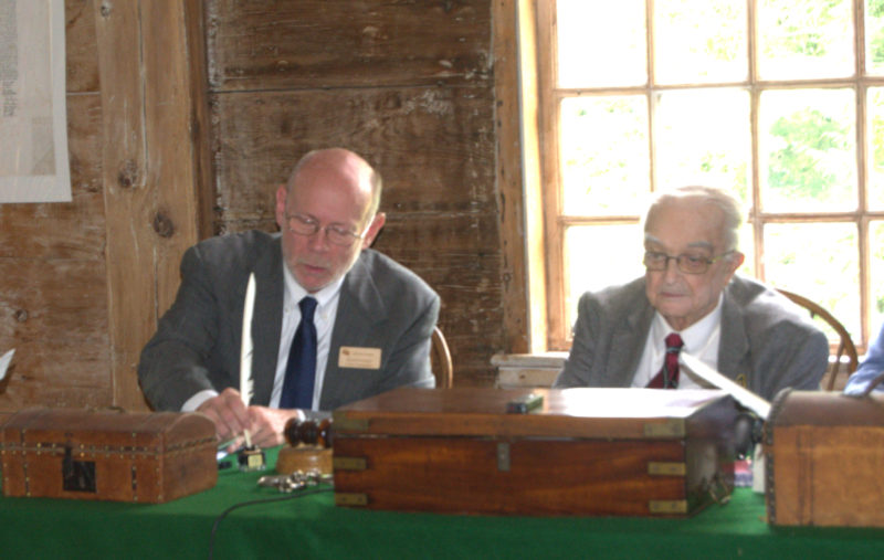 Commissioner David Levesque uses a quill to sign a document, one of the nods to Pownalborough Court House's history at the Tuesday, July 7 meeting. (Lily Wasserman photo)