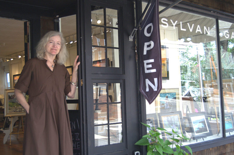 Sylvan Gallery director Ann Scanlan stands in the doorway of her gallery on June 30. The gallery has been in the same building since 2015. (Lily Wasserman photo)