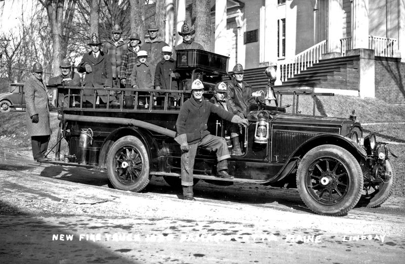 Members of the Massasoit Engine Co. stand with their new 1930 Packard fire truck. This truck was used to battle the Lincoln County Motor garage fire which destroyed 22 cards and two trucks on Junuary 10, 1936. The two young boys in the truck are Horace C. Brewer and brother Prescott Brewer.