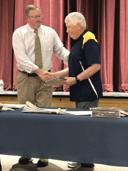 George Gould (right) receives a plaque from Medomak Valley Athletic Director Matt Lash to honor his 2,000th win as a Panthers coach on June 15 in Waldoboro. (Courtesy photo)