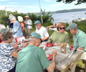 The Wood Chips enjoy a much-deserved summer picnic after a winter of sawing, splitting, stacking and delivering firewood. The team delivered 54 cords of wood to as many households this winter. (Photo courtesy Community Housing Improvement Project Inc.)