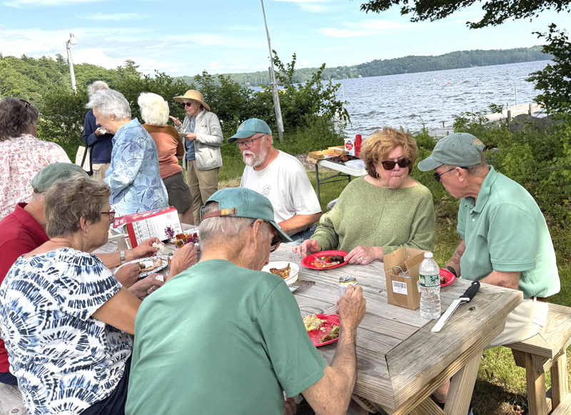 The Wood Chips enjoy a much-deserved summer picnic after a winter of sawing, splitting, stacking and delivering firewood. The team delivered 54 cords of wood to as many households this winter. (Photo courtesy Community Housing Improvement Project Inc.)